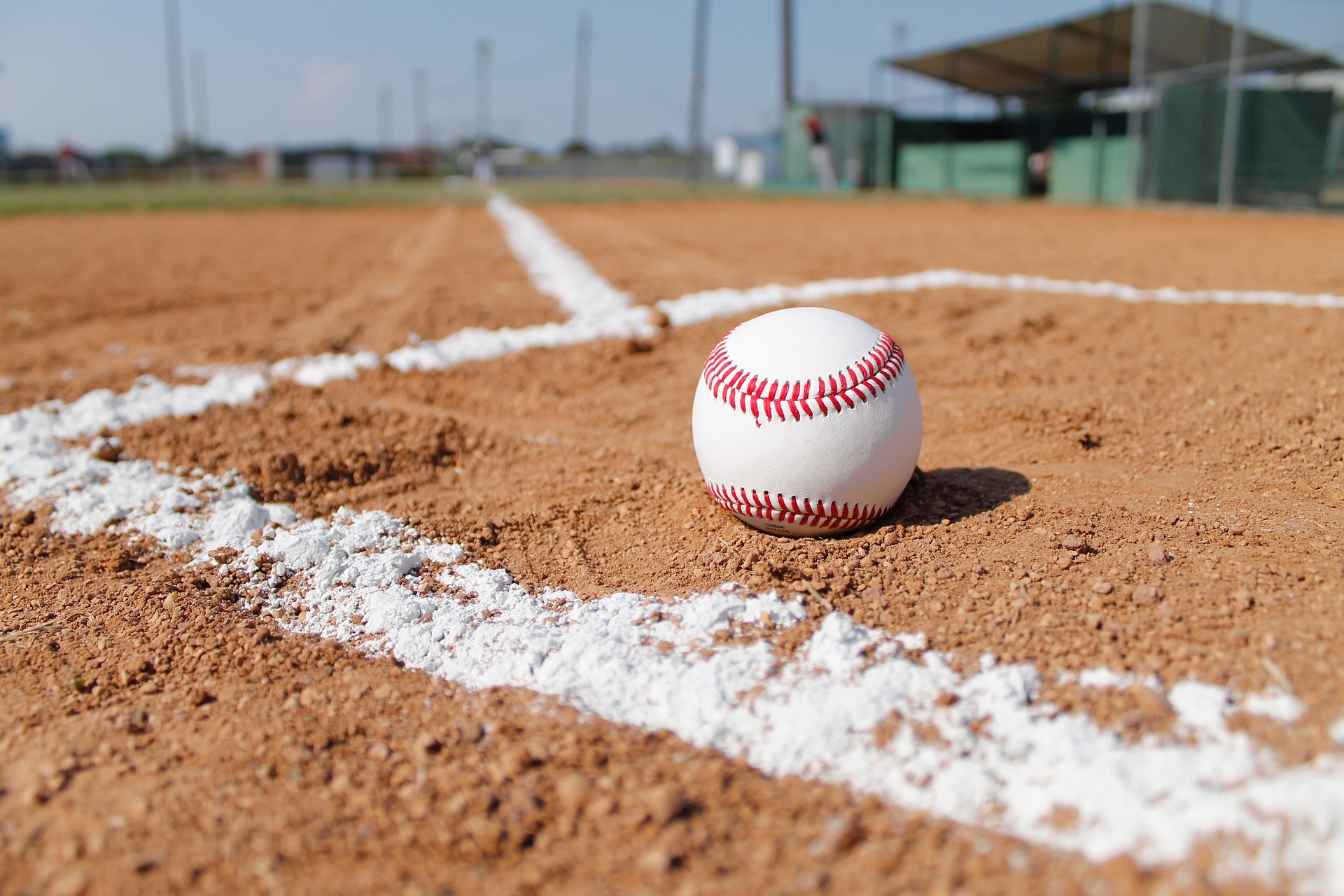 Baseball ball on a baseball field. The ball is placed in a boxed area used white pitch lines: Baseball vs Softball [MindfuseBaseball.com]